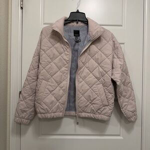 Vuori Women's Quilted Puffer Jacket - creamy light pinkish color